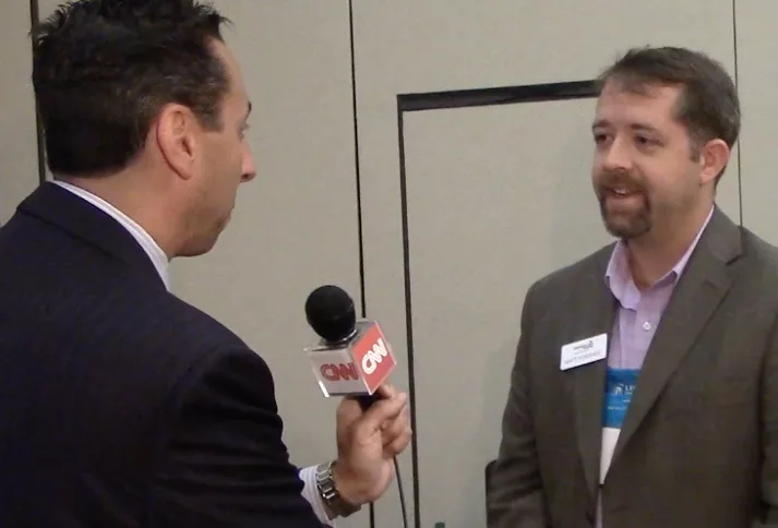 Jess Todtfeld training a nonprofit leader in a mock television interview