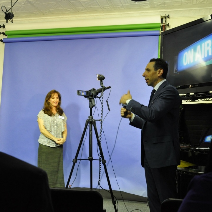 Jess Todtfeld coaching a participant on camera during a live presentation training workshop