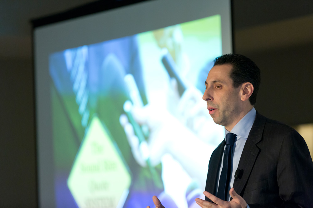 Jess Todtfeld speaking to an audience from the front of the room during a leadership communication program