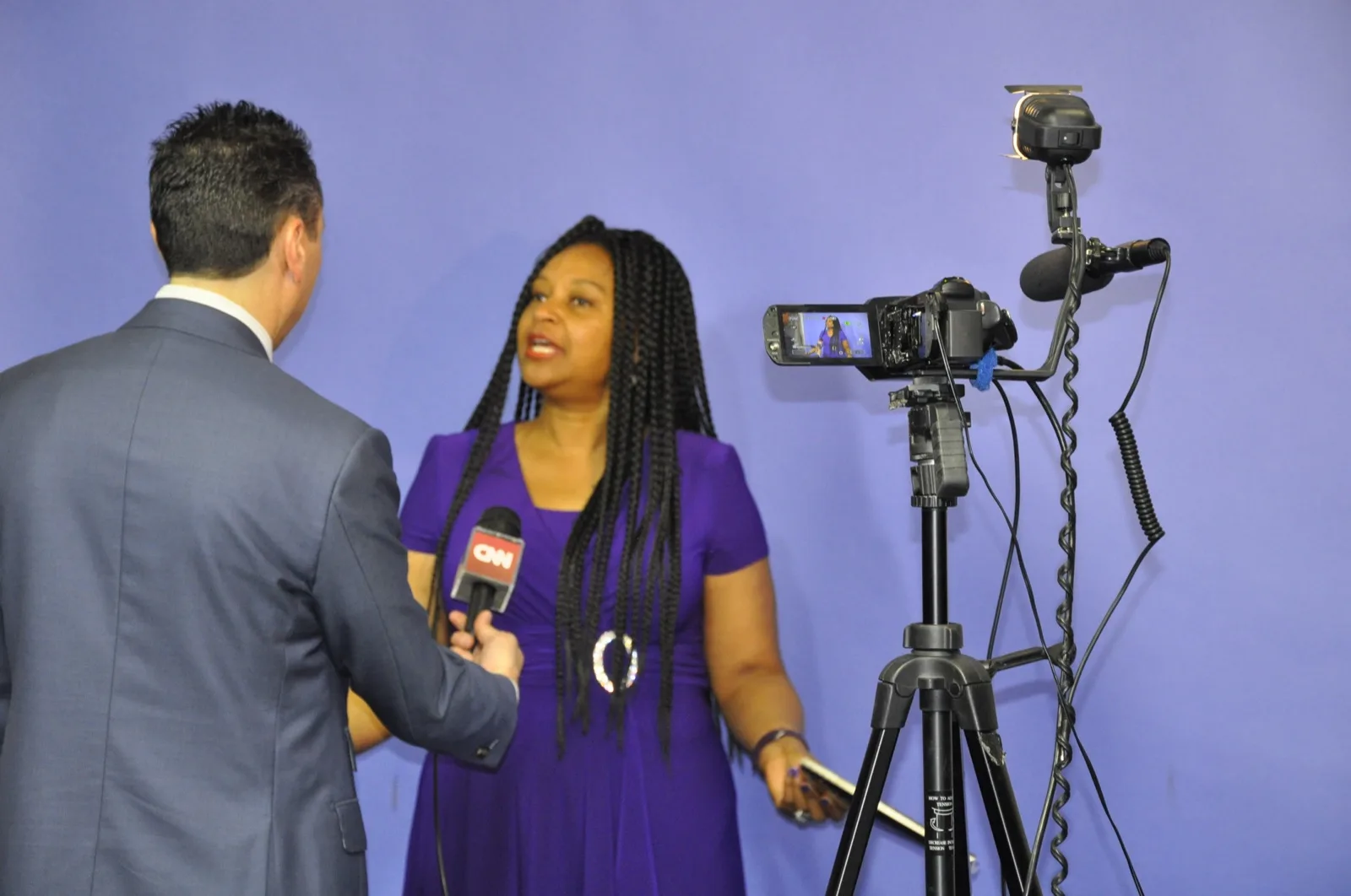 Jess Todtfeld coaching a spokesperson during an on-camera media training rehearsal